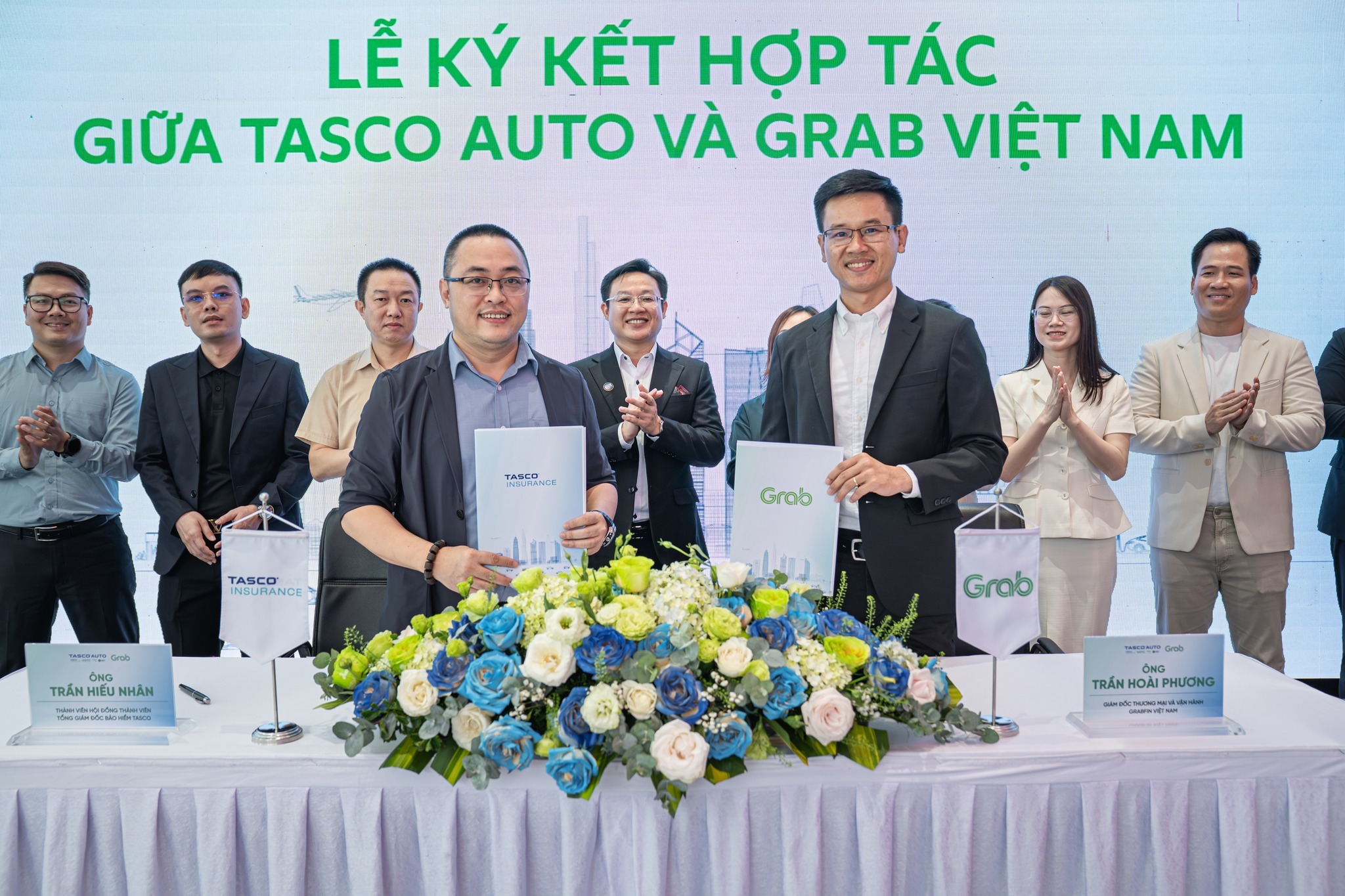 Hình ảnh sự kiện lễ ký kết hợp tác giữa Tasco Auto và Grab Việt Nam. Đại diện Bảo hiểm Tasco